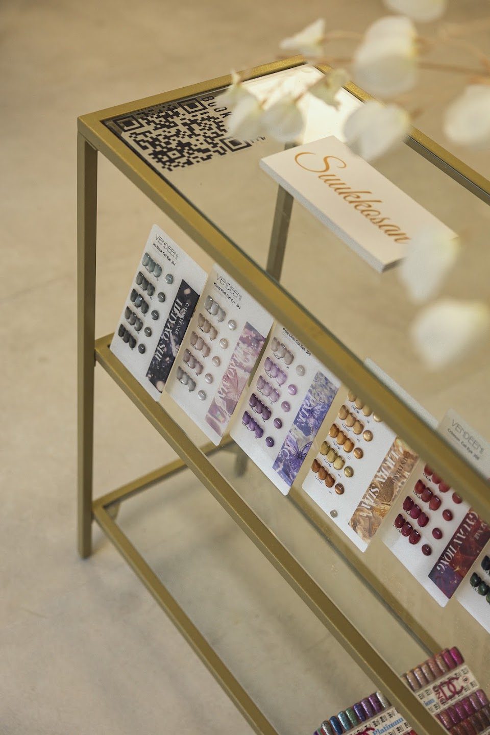 A gel colour chart stand with Suukkosan signage