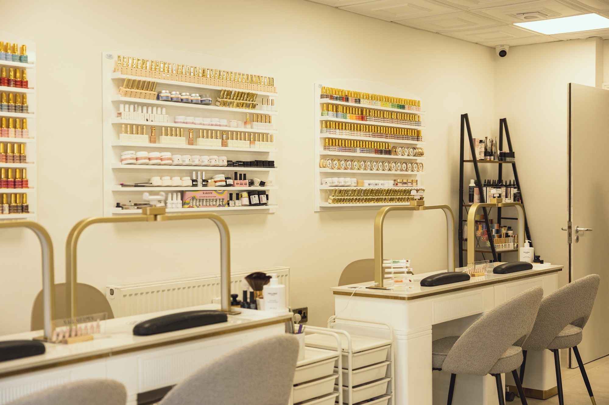 Nail desks and the wall of gel polish colours at Suukkosan