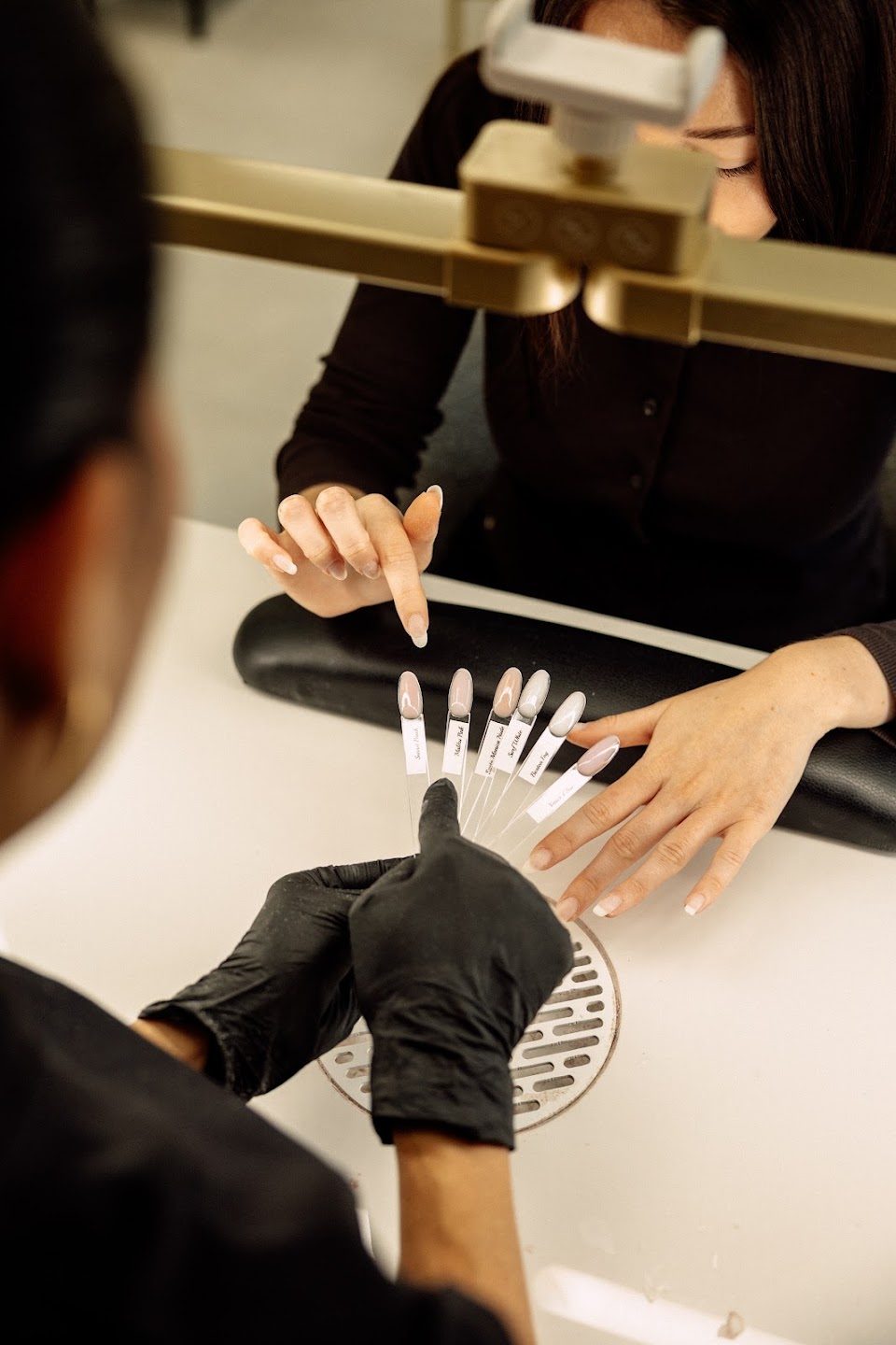Nail tips being prepared at the desk