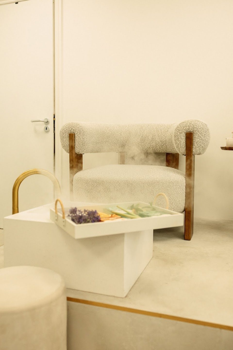A pedicure chair and footstool with a treatment tray in the Suukkosan salon