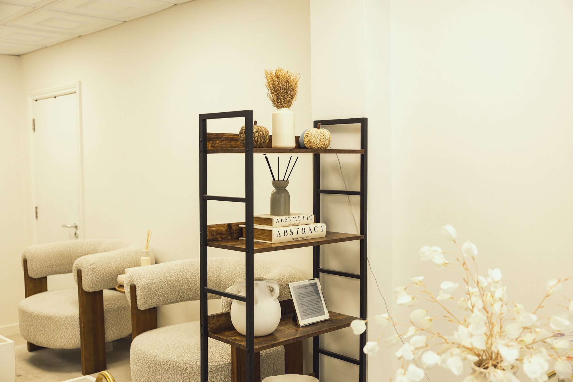 Armchairs and shelving in a bright corner of the Suukkosan salon