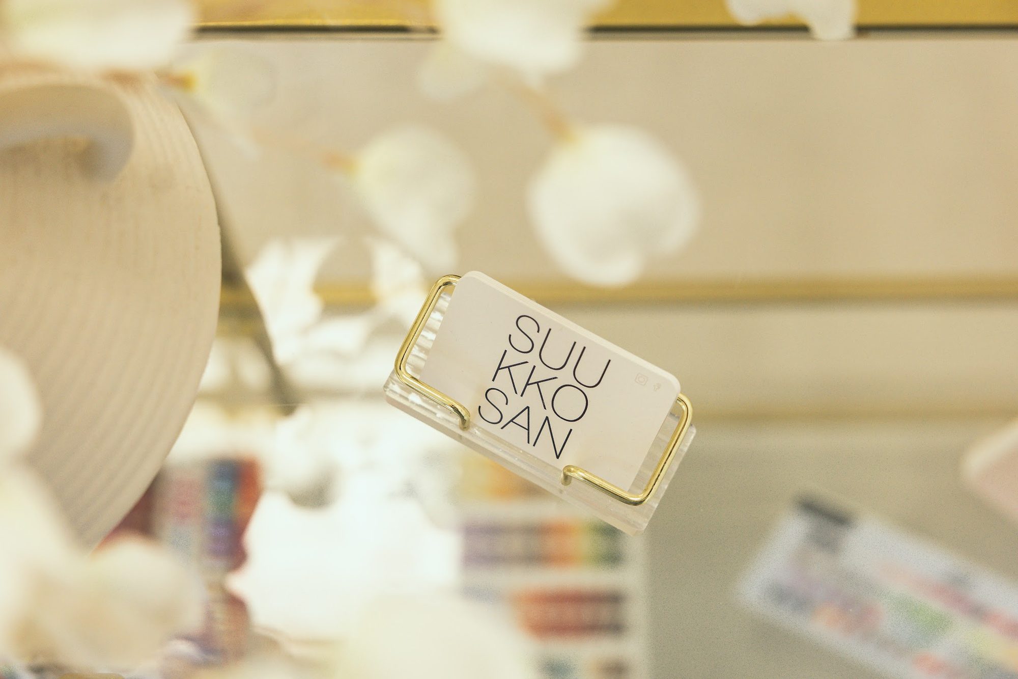 A Suukkosan card among dried flowers